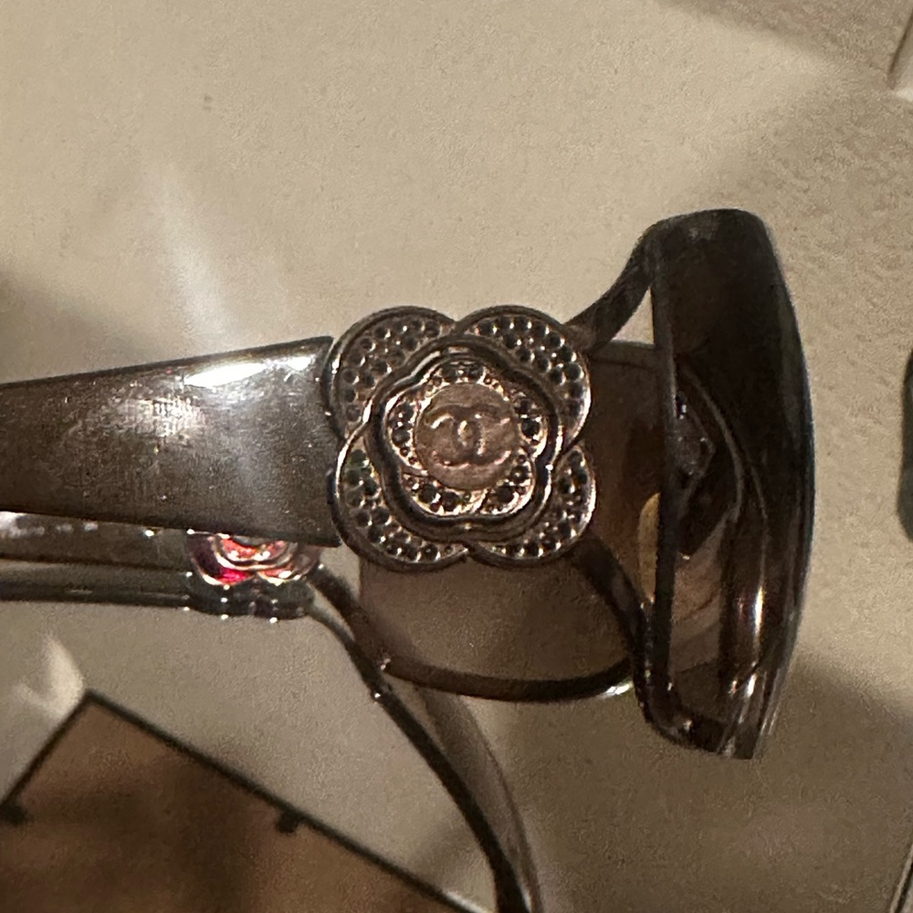 CHANEL Sunglasses with Black Lenses and Silver Floral Accent